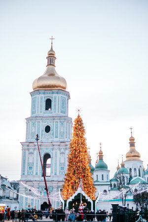 Kyiv, Ukraine - December 20, 2019: Christmas tree on the Saint Sophias Cathedral background. Christmas fairs in Kyiv with traditional street market and winter outdoor fun.のeditorial素材