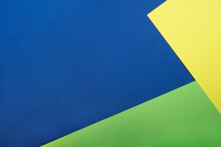 Bright abstrackt geometric background of neon green, lemon yellow and classic blue colors.の写真素材