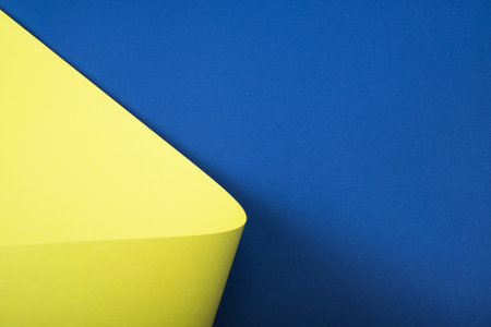 Bright abstrackt geometric background of lemon yellow and classic blue colors.の写真素材