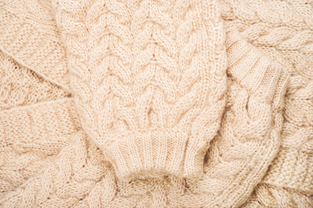 Cozy background of beige cardigan knitwear texture.の写真素材