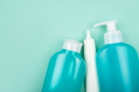 Flatlay with cosmetic packaging plastic bottles isolated on blue background. Plastic-free concept.の写真素材