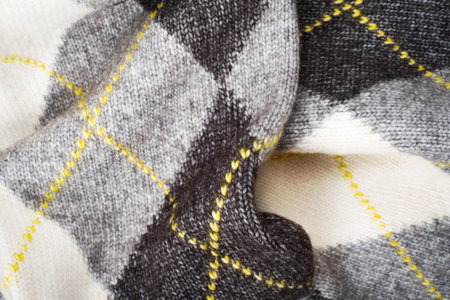Cozy background of grey knitted texture wish argyle print.の写真素材