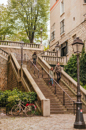 Paris, France - April 9, 2019: beautiful streets of Monmartre, historical district of Paris.のeditorial素材