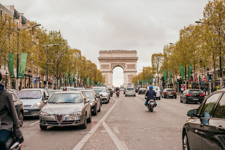 Paris, France - April 8, 2019: view on Arc de Triomphe monument from Avenue de Champs-Elysees.のeditorial素材