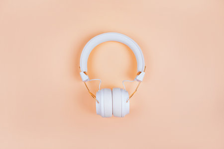 Flatlay with stylish white headphones isolated on turquoise background.の写真素材