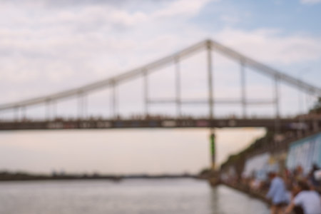 Blurred background of bridge on the sunset. Cityscape captured on the river.の写真素材