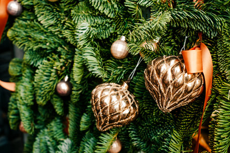 Beautiful Christmas tree decoration with garland and baubles on blurred background.の写真素材