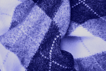 Cozy background of violet knitted texture wish argyle print.の写真素材