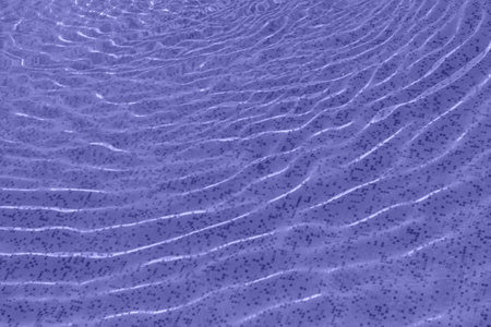 Bright violet surface swimming pool water background.の写真素材