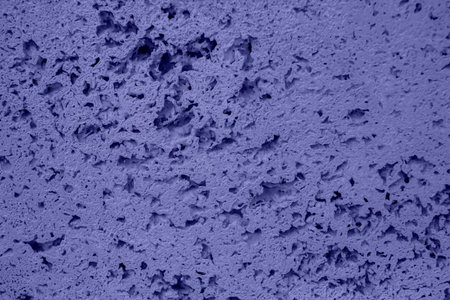 Textured background of a stone colored in violet.の写真素材