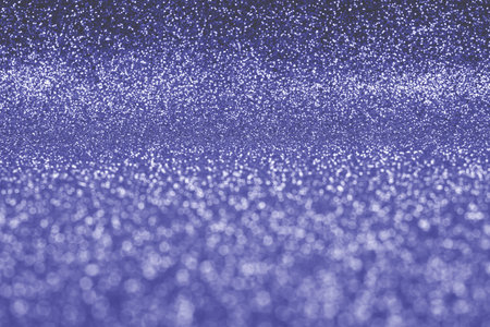 Violet abstract background with soft glitter bokeh lights.の写真素材