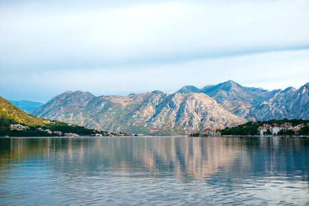 Amazing clear water of the Bay of Kotor at sunrise.の写真素材
