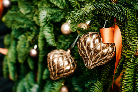 Beautiful Christmas tree decoration with garland and baubles on blurred background.の写真素材