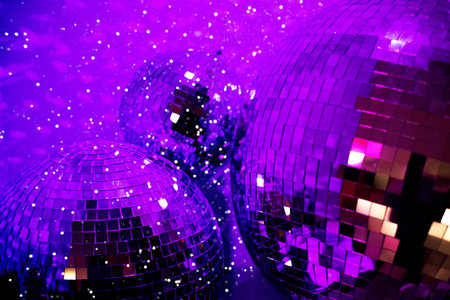 Purple colored party disco ball baubles on violet background.の写真素材