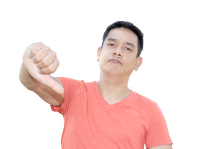 Man show thumb down on white background