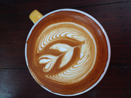 cup of cappuccino on wood backgroundの写真素材