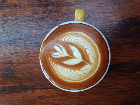 cup of cappuccino on wood backgroundの写真素材