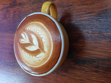 cup of cappuccino on wood backgroundの写真素材