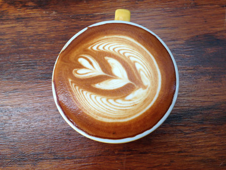 cup of cappuccino on wood backgroundの写真素材
