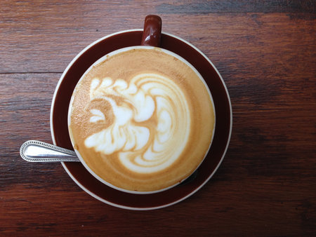 A cup of coffee on wooden backgroundの写真素材