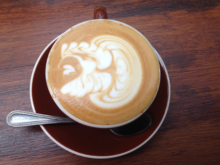 A cup of coffee on wooden backgroundの写真素材