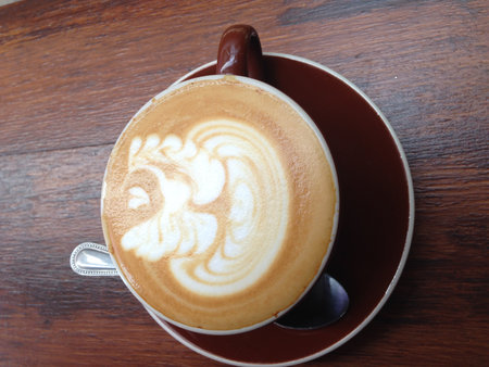A cup of coffee on wooden backgroundの写真素材