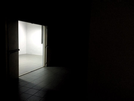 Light from the door in dark room / abstract photographyの写真素材