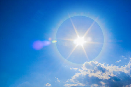 Beautiful fantastic sun halo phenomenon in sky, Sun with circular rainbow.