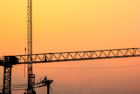 Silhouette cranes at construction side with the twilight sky in evening.の写真素材