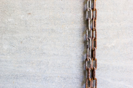 Old rusty chain on cement background with copy spaceの写真素材