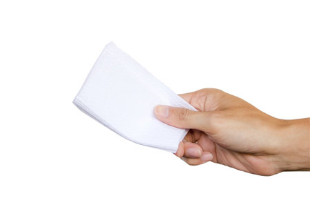 Hand holding paper napkin isolated on white background with clipping path. の写真素材