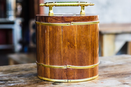 Wood Piggy bank on wooden table. Handmade wooden piggy bank for saving money for the future.の写真素材