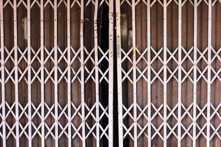 Old iron steel close up. Full frame. Steel doors used widely in Thailand before. Steel door can be stretched and folded.の写真素材