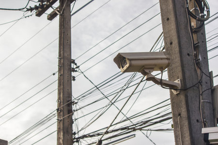Close Circuit Television on electricity background. Safety camera online. 