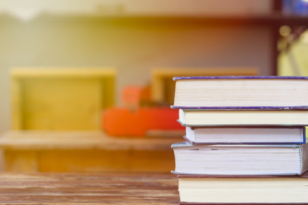 Education and reading concept - group of stack books on the wooden table with copy space for text....