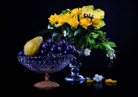 Still life with yellow roses and fruitsの写真素材