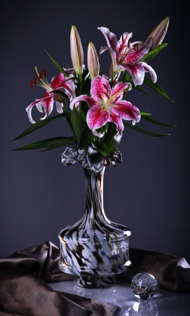 Still life with pink  lily flowers  in a glass vase の写真素材