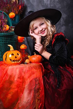 Girl with a Halloween pumpkin の写真素材