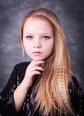 Portrait of beautiful pretty young girl with long blonde hairの写真素材