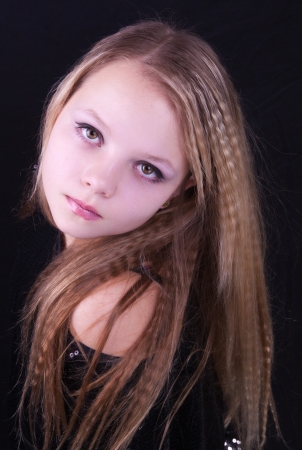 Portrait of beautiful pretty young girl with long blonde hairの写真素材