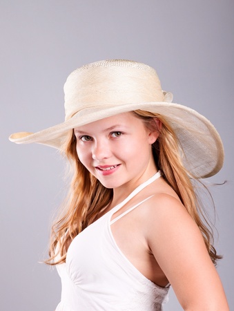 
Summer portrait, beautiful blond girl  wearing straw hat の写真素材