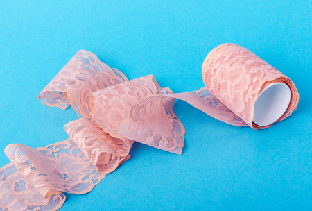 closeup of vintage pink lace patterned with flowersの写真素材