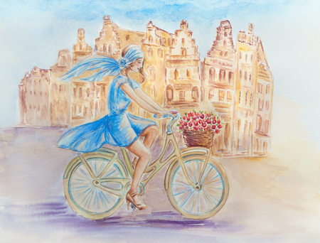 Girl on a bicycle in the old townの写真素材