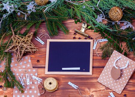 Christmas background with Chalkboard and  winter foliageの写真素材