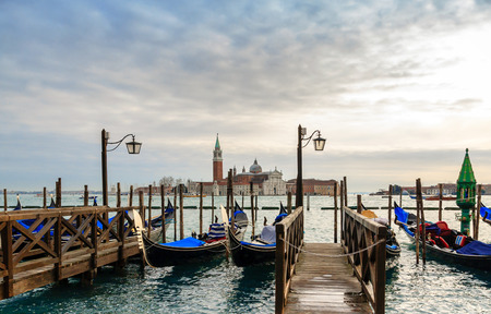 Venice gondolas moored by Saint Mark square during winter daysの写真素材