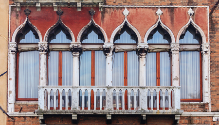 View of old window in historical buildings in Venice, Italyの写真素材