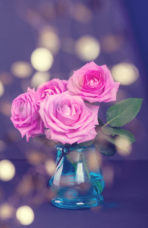 Bouquet of fresh pink roses  with bokeh lightsの写真素材