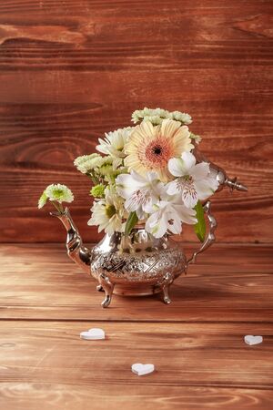 Stack of vintage tea cups on wooden backgroundの写真素材