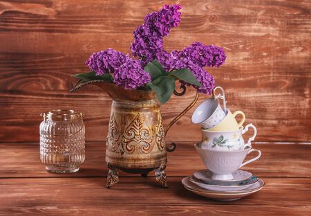 lilac in vintage vase on old wooden backgroundの写真素材