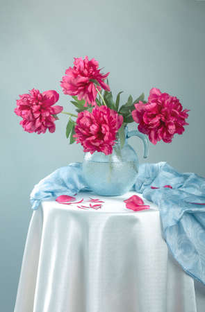 Still life with beautiful pink peonies in glass vaseの写真素材